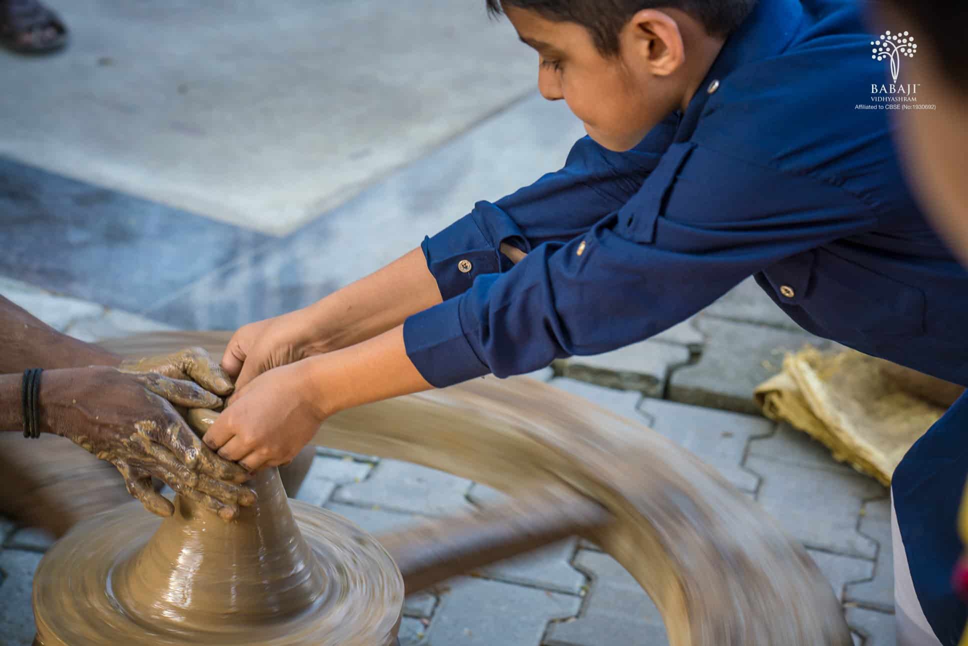 A Babaji Vidyashram School Boy Student trying out his hand at the pottery session